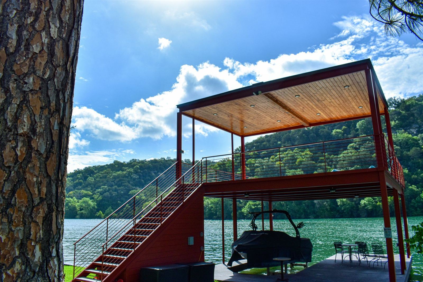 Two-story steel pavilion with shaded lower deck