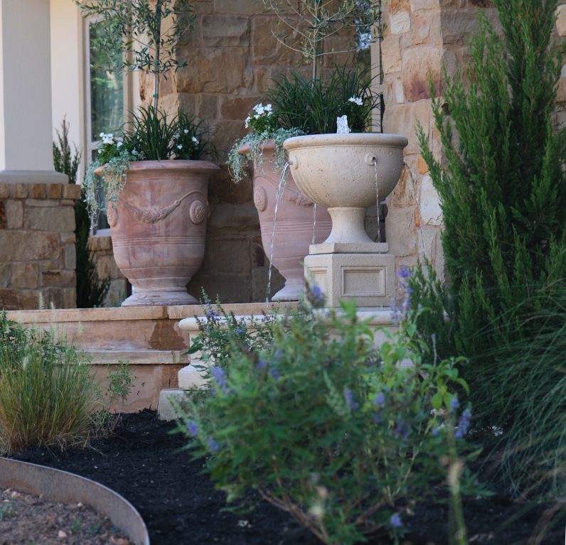 Completed landscape with stone veneer and planting beds