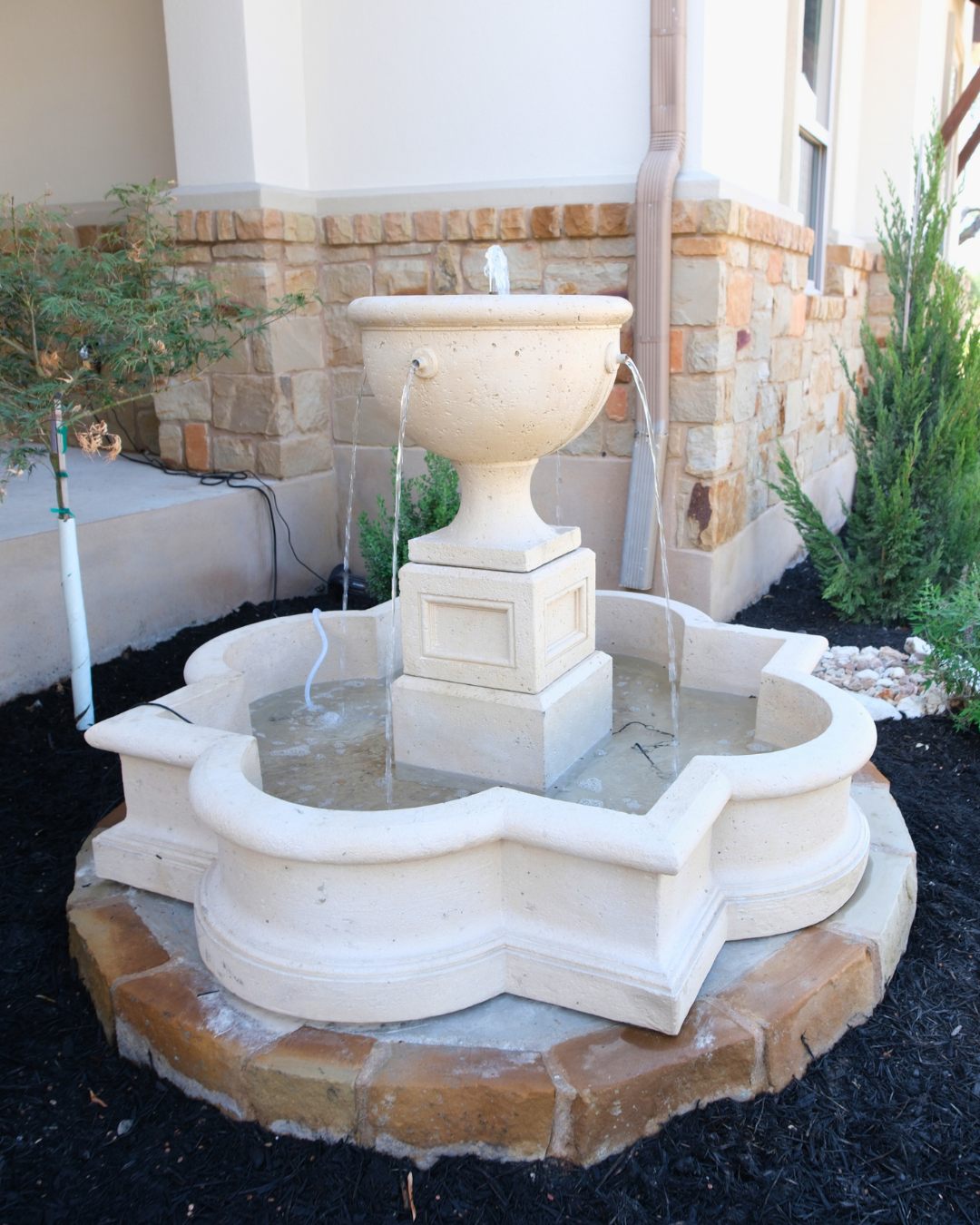 Custom stone fountain with cascading urn